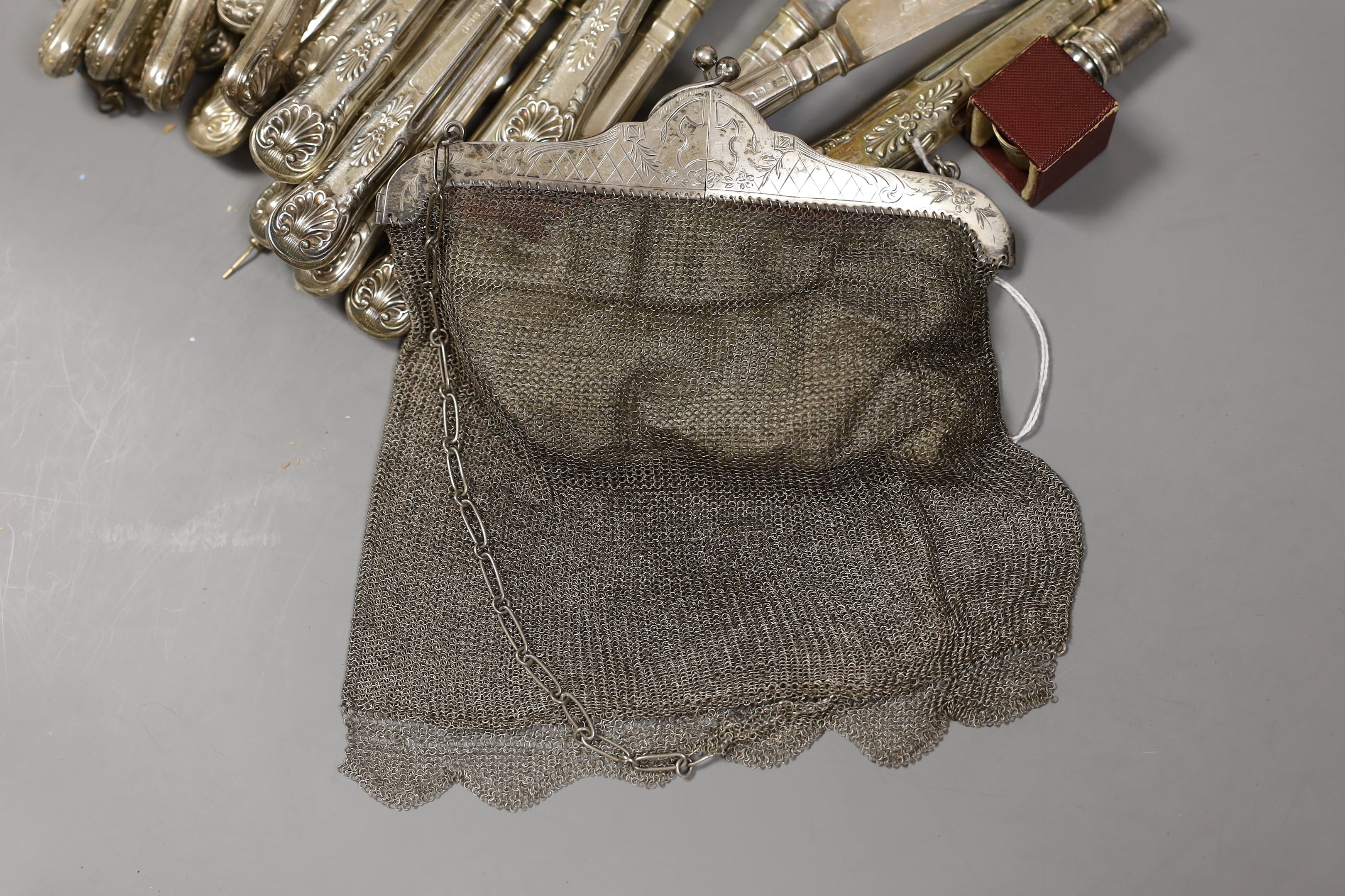 A pair of George VI silver fish servers, Carrington & Co, London 1939 and eleven pairs of matching fish eaters, together with a continental white metal skewer, a modern silver handled cake slice and cheese knife, a lady'